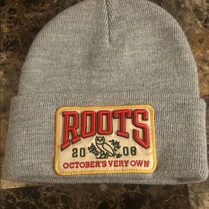 Roots Gray Beanie with Red and Gold Patch